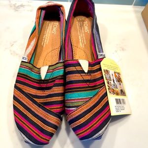 Classic TOMS slip on shoes in multi stripe style